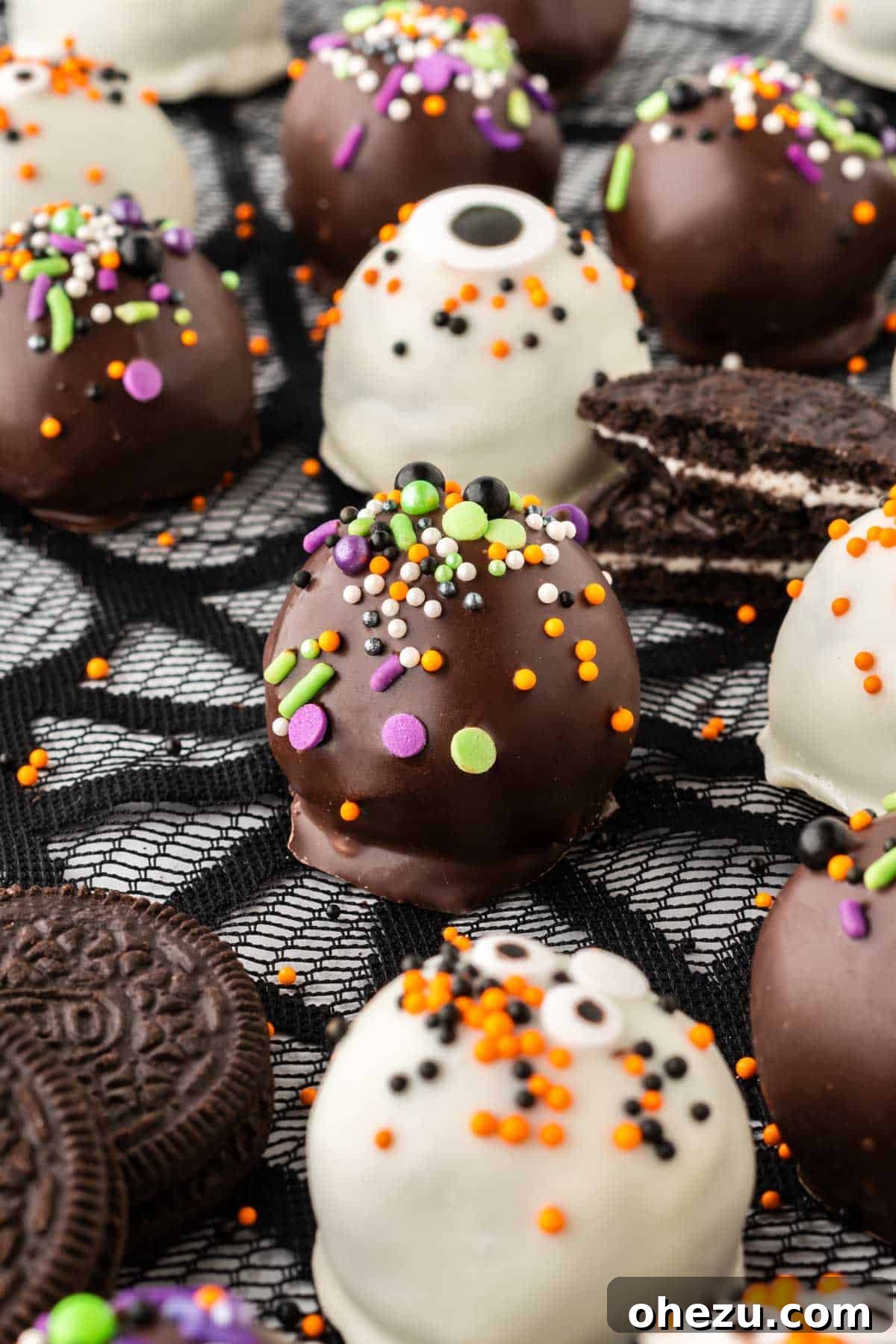 Wicked Oreo Truffles 20 A close-up view of multiple Halloween Oreo balls, showcasing their festive decorations