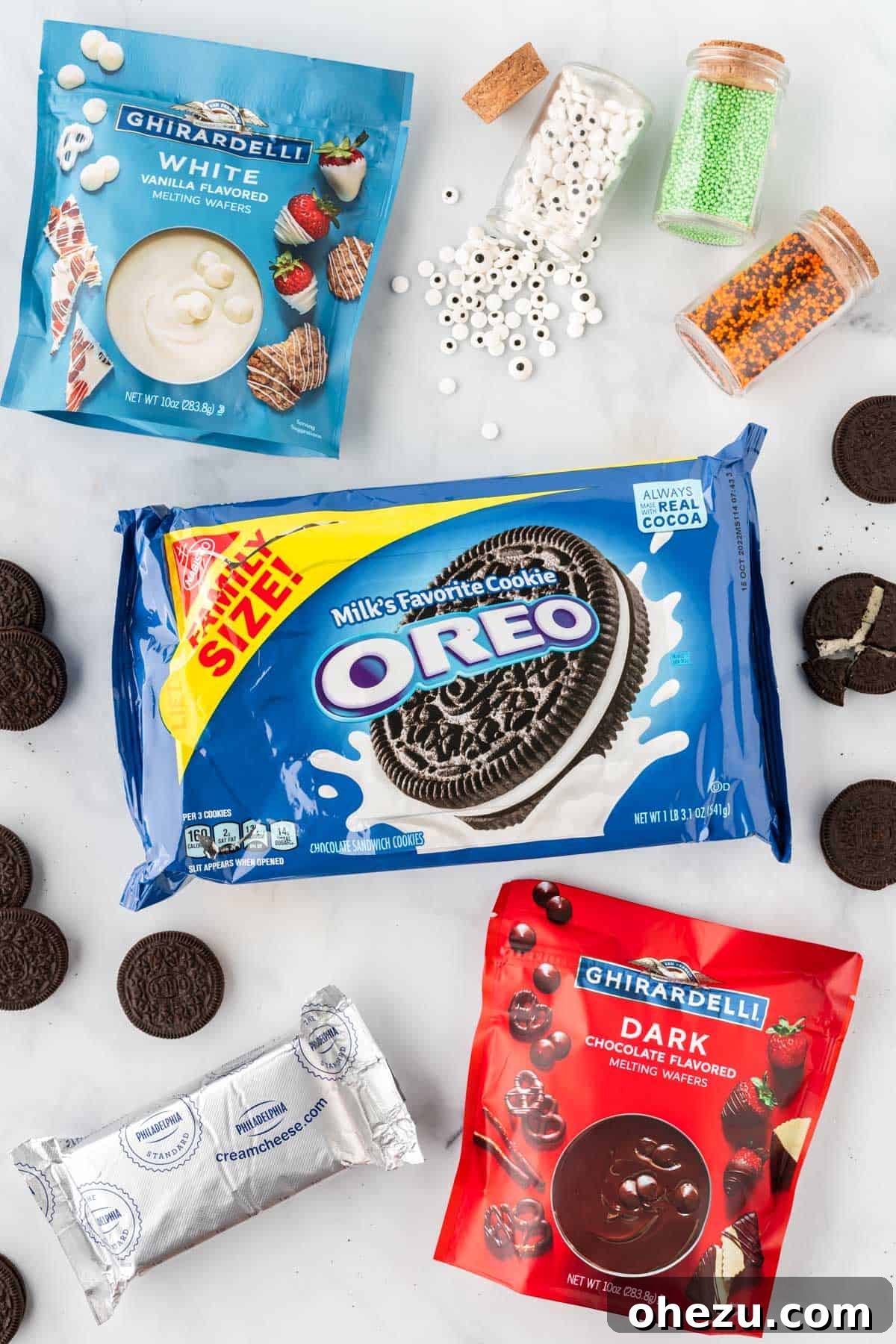 Wicked Oreo Truffles 4 A collection of ingredients needed to make Halloween Oreo balls: Oreos, cream cheese, dark and white chocolate wafers, sprinkles, and candy eyes