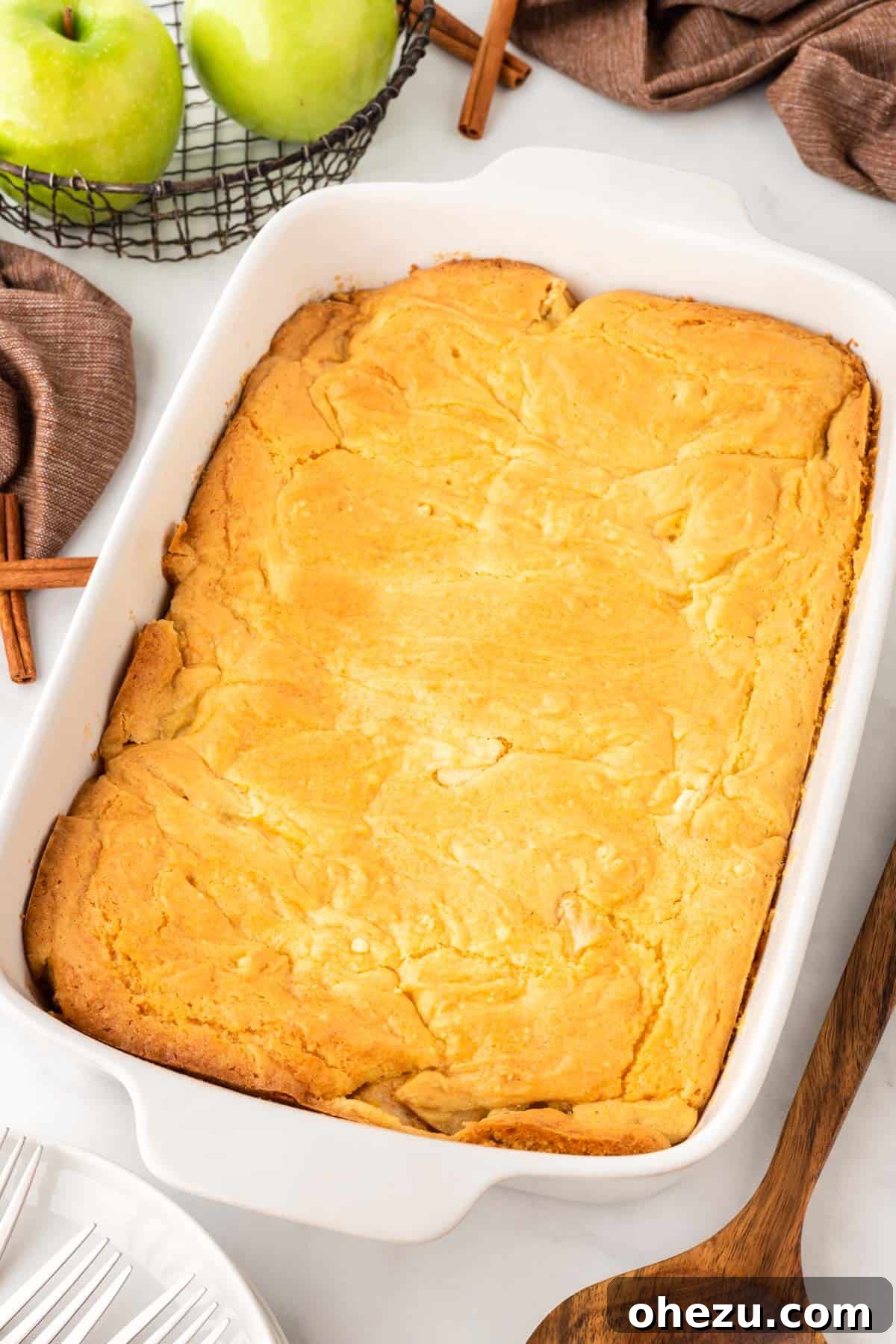 A freshly baked cake mix apple cobbler, golden brown and bubbly, pulled from the oven and ready to be served.