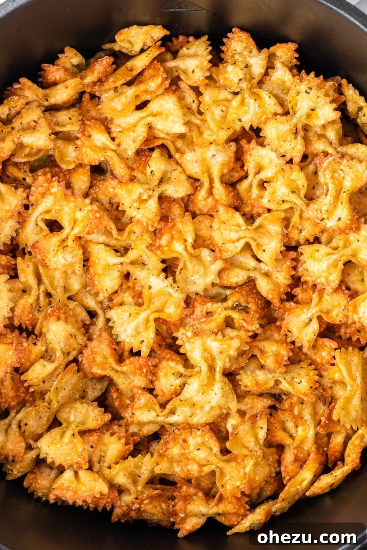 Perfectly crispy, golden-brown air fryer pasta chips fresh out of the air fryer