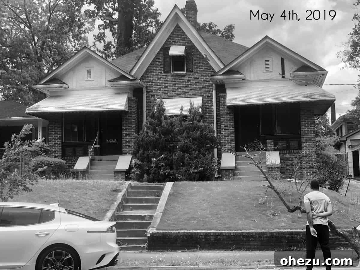 Unlock Your Dream Home: My FHA 203K Loan Renovation Guide 3 Proud homeowner looking at his fixer upper renovation project