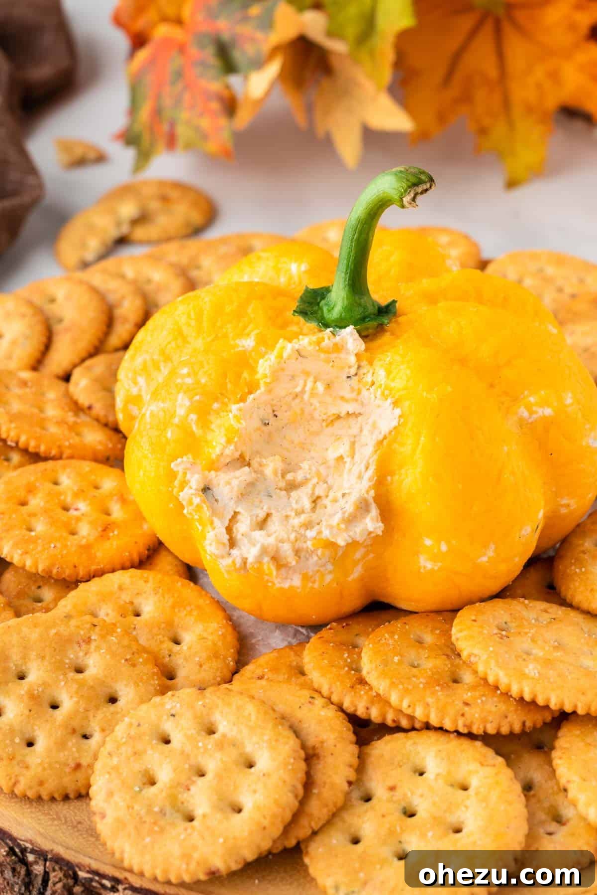 cheese ball cut open to show the creamy cheese dip filling