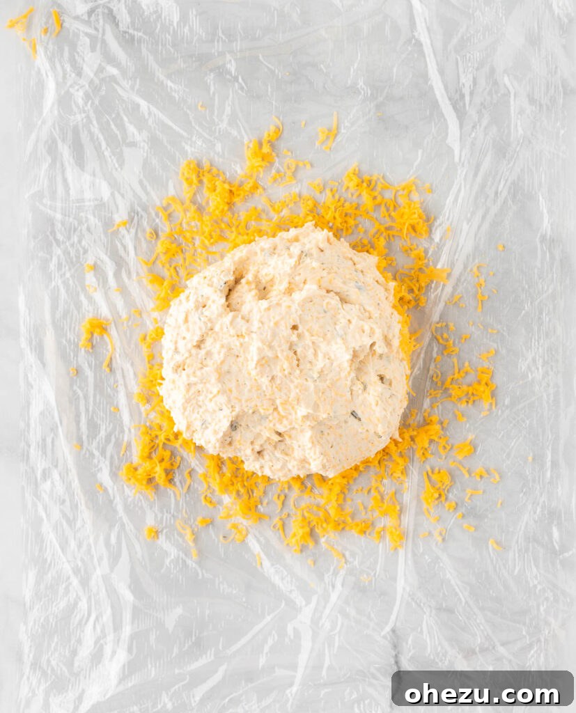 cheese ball placed over the cheddar cheese