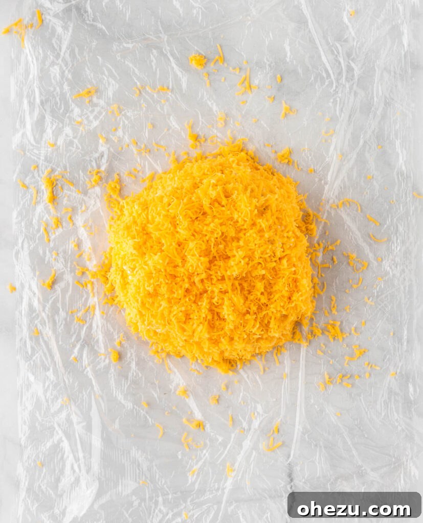 cheese ball coated in cheddar cheese