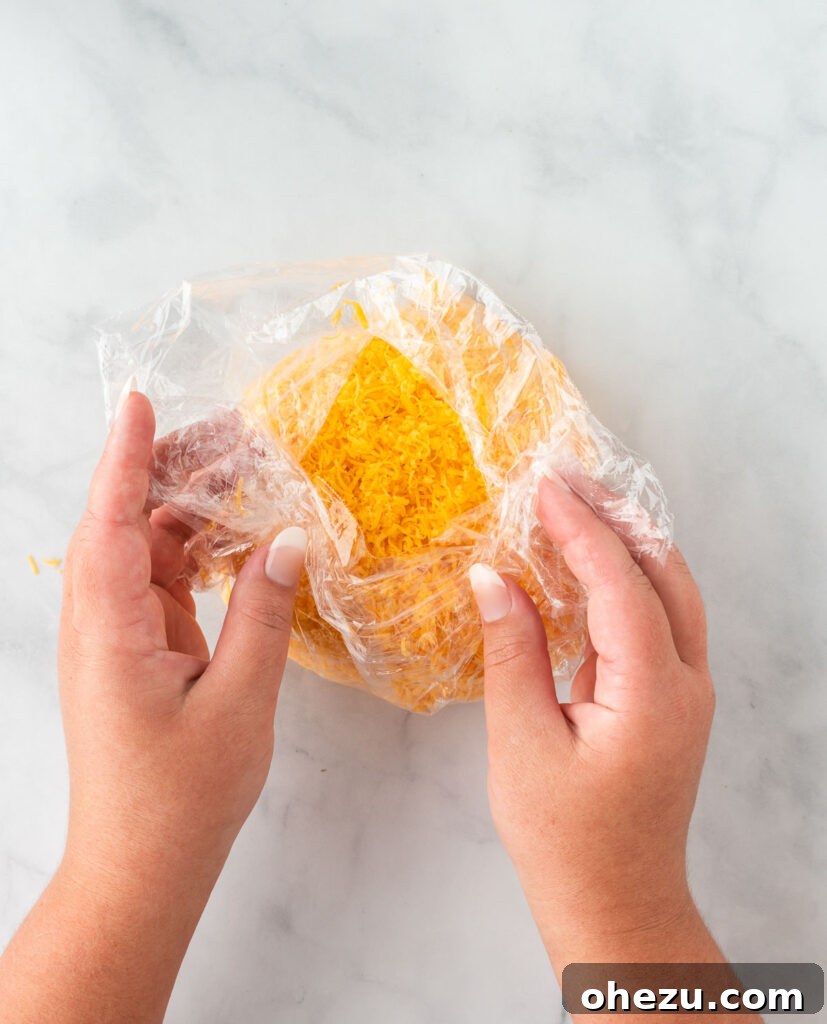 wrapping the cheese ball with cling wrap