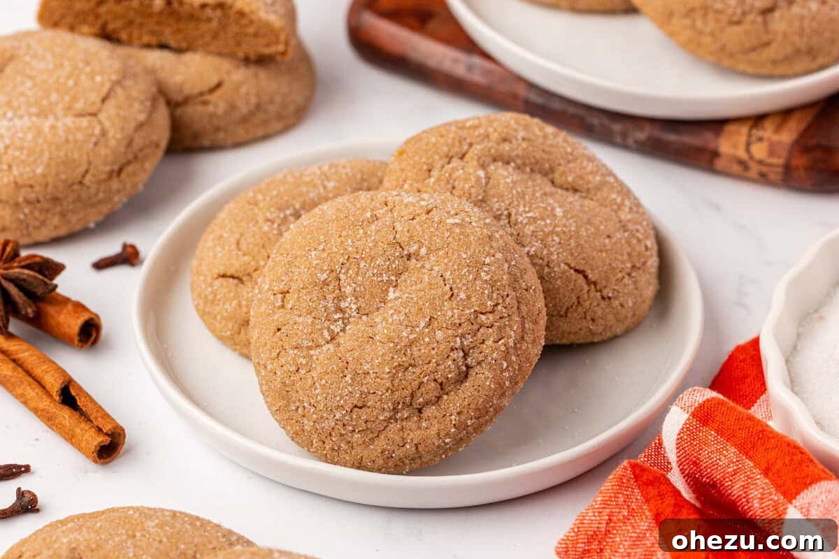 A batch of warm Cake Mix Spice Cookies gently cooling on a wire rack, steam subtly rising.
