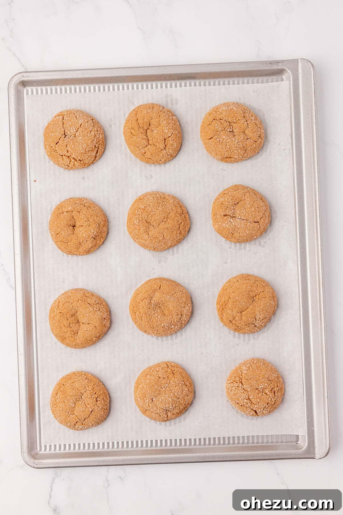 A baking sheet filled with freshly baked Cake Mix Spice Cookies, golden brown and perfectly puffed, straight from the oven.
