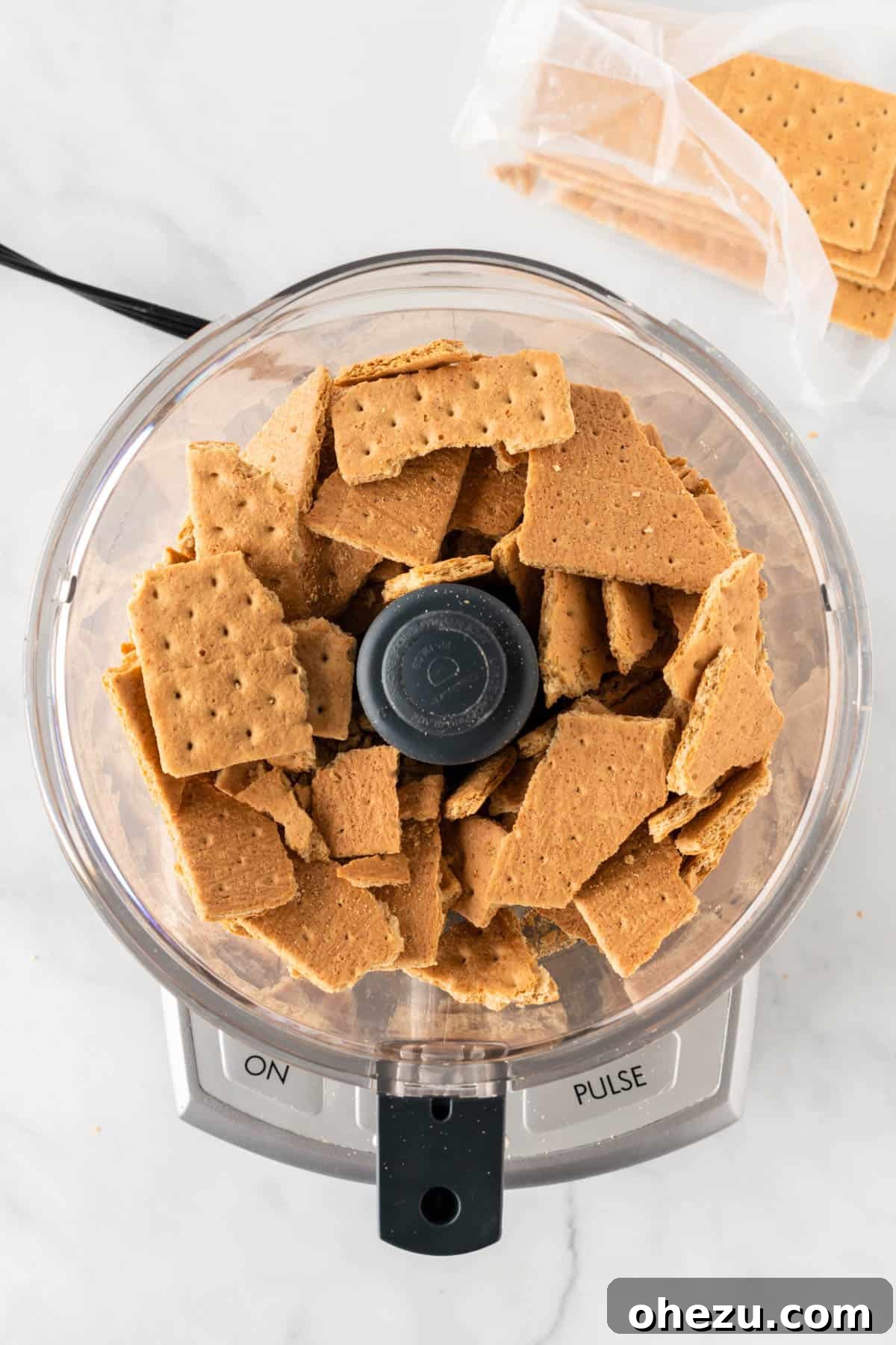 graham crackers being processed in a food processor
