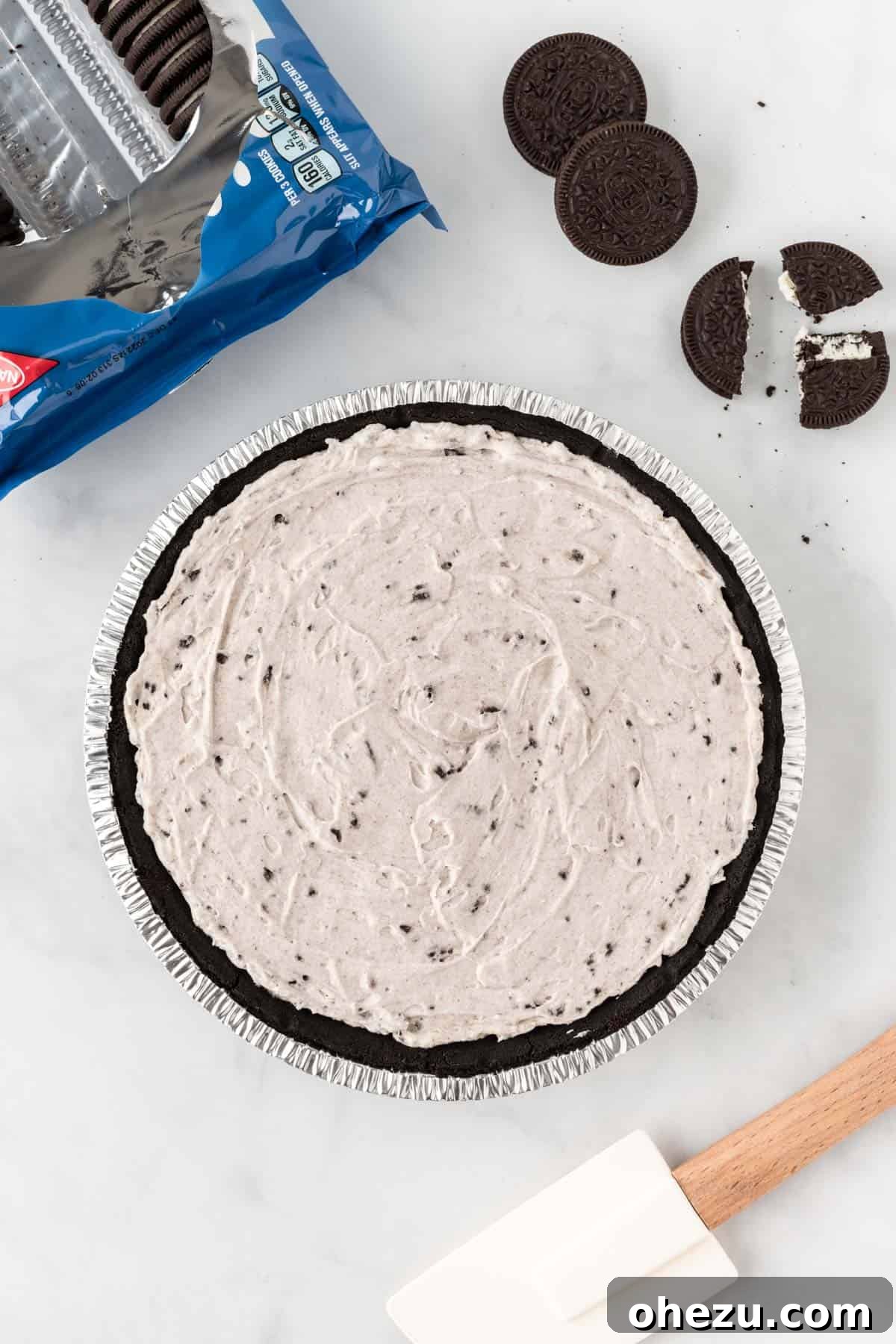 Decadent Oreo Delight 8 The smooth Oreo pie filling evenly spread within the dark chocolate Oreo pie crust, glistening and ready for chilling.