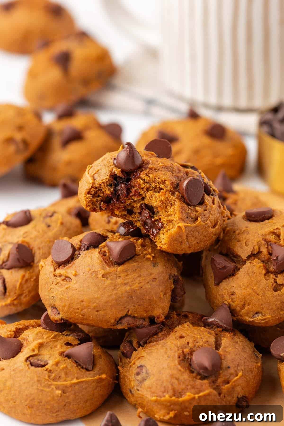 A stack of perfectly baked cake mix pumpkin cookies, ready to be enjoyed as a seasonal treat.