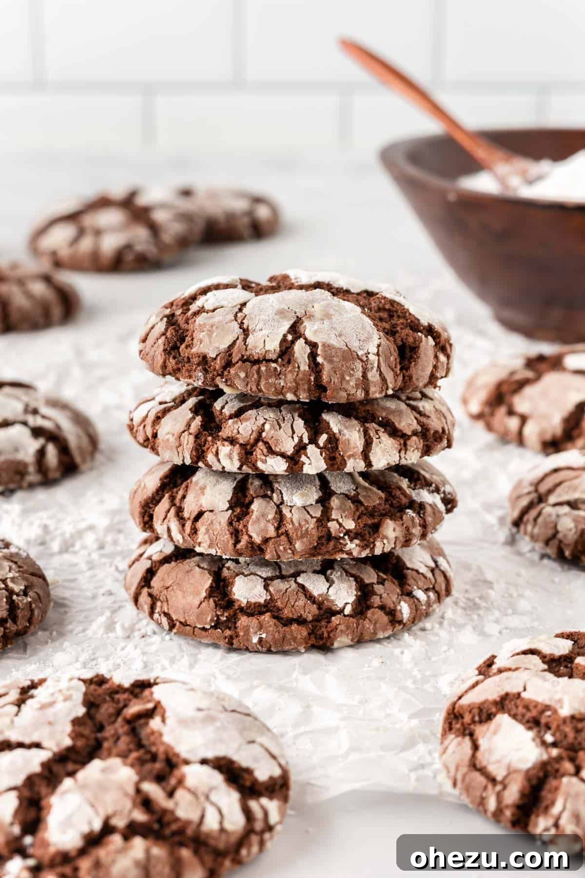 A large stack of cake mix crinkle cookies, ready to be enjoyed