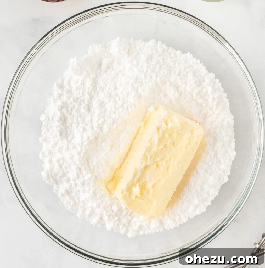 powdered sugar and softened butter in a mixing bowl for frosting