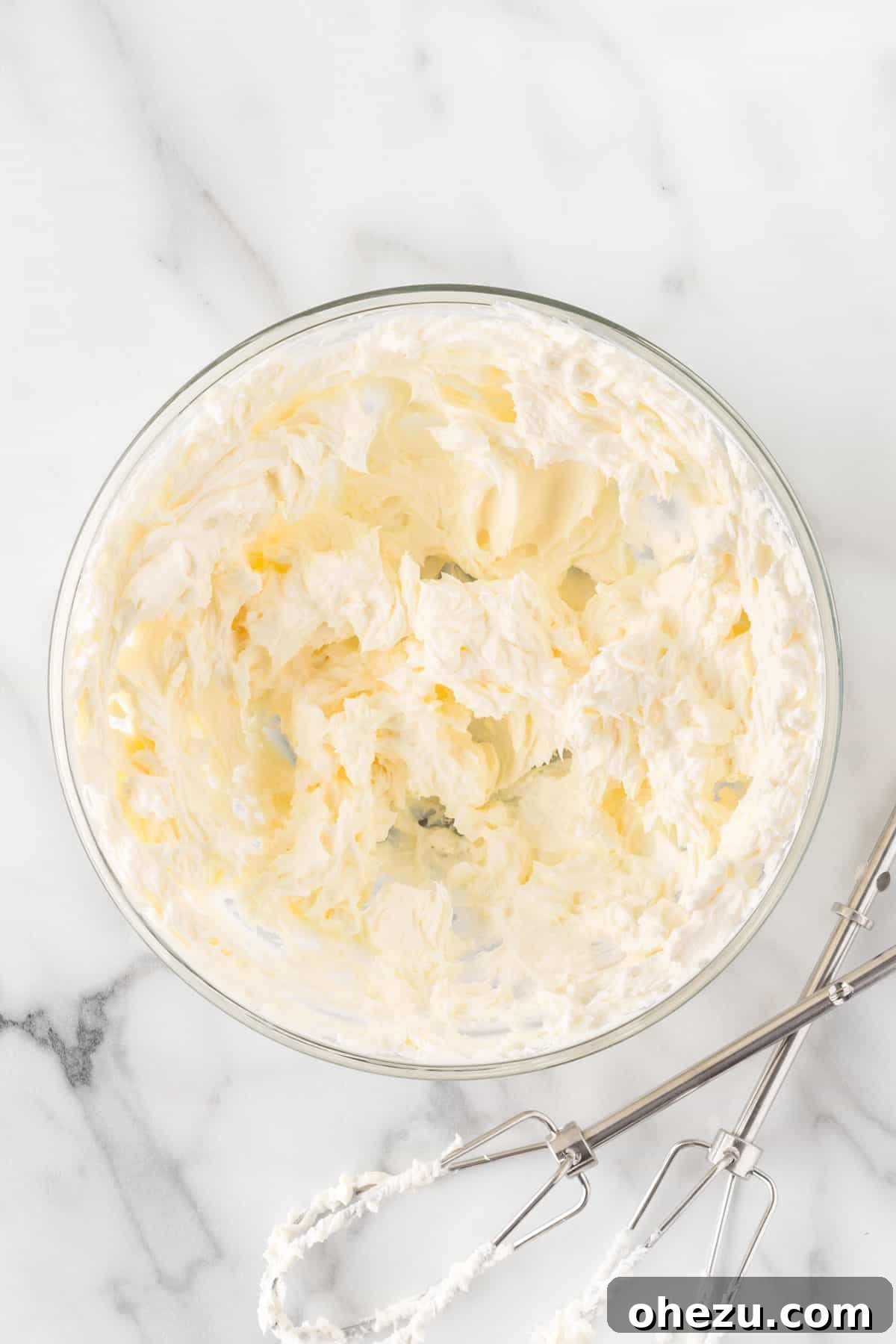 Oreo Dream Dip 5 Smooth, whipped cream cheese in a mixing bowl