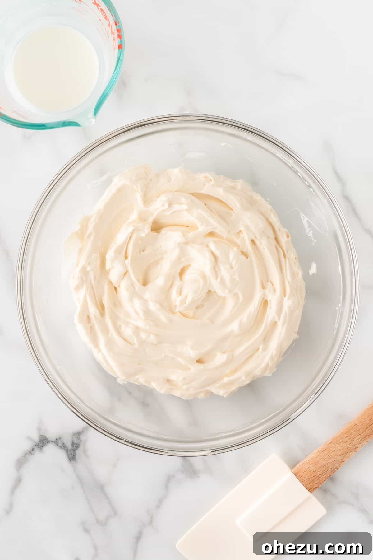 The fluffy, creamy cheesecake filling after the cream cheese and whipped cream have been gently folded together, ready for the berries.