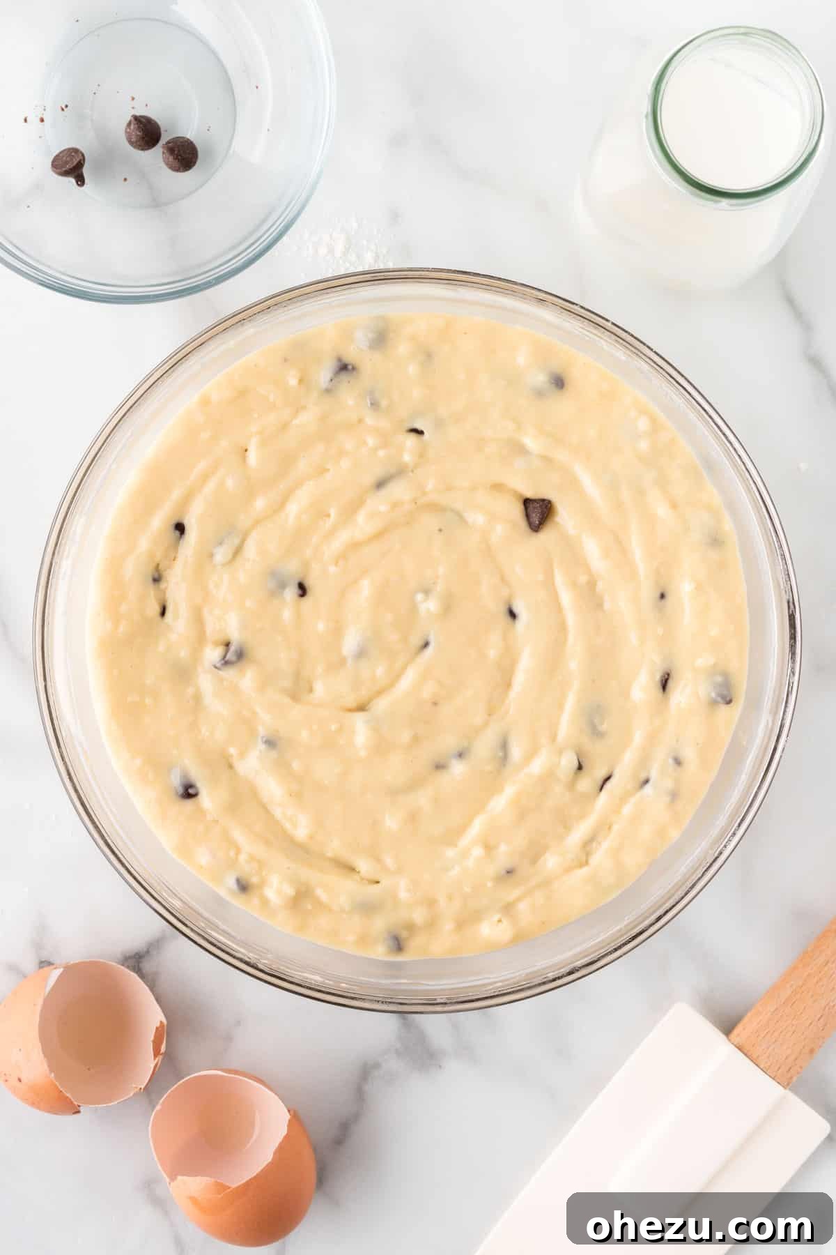 Irresistible Bakery Chocolate Chip Muffins 11 chocolate chip muffin batter in a mixing bowl