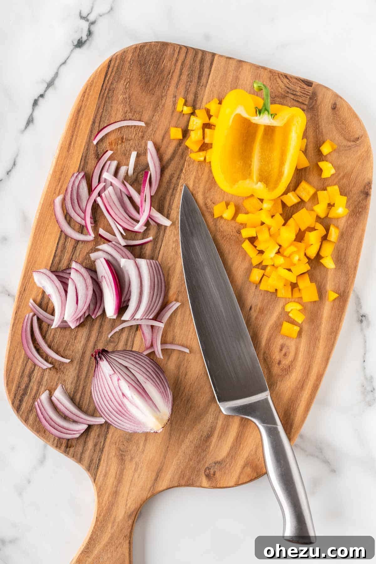 Fiesta Fresh Salad 4 cut up bell pepper and onion on a cutting board, neatly diced and ready for the salad