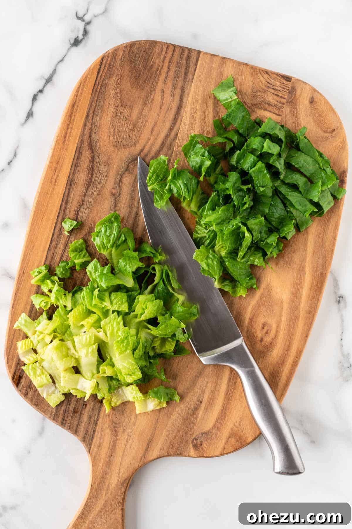 Fiesta Fresh Salad 5 cut up romaine lettuce on a cutting board, showing its crisp texture