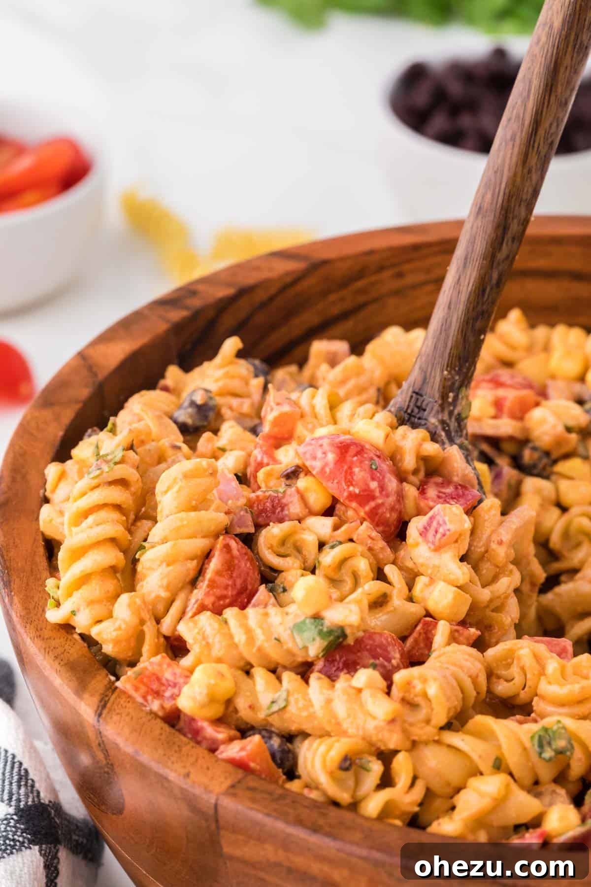 Zesty Fiesta Pasta Salad 12 Another view of the delicious southwest pasta salad in a rustic brown serving bowl, ready to be enjoyed.