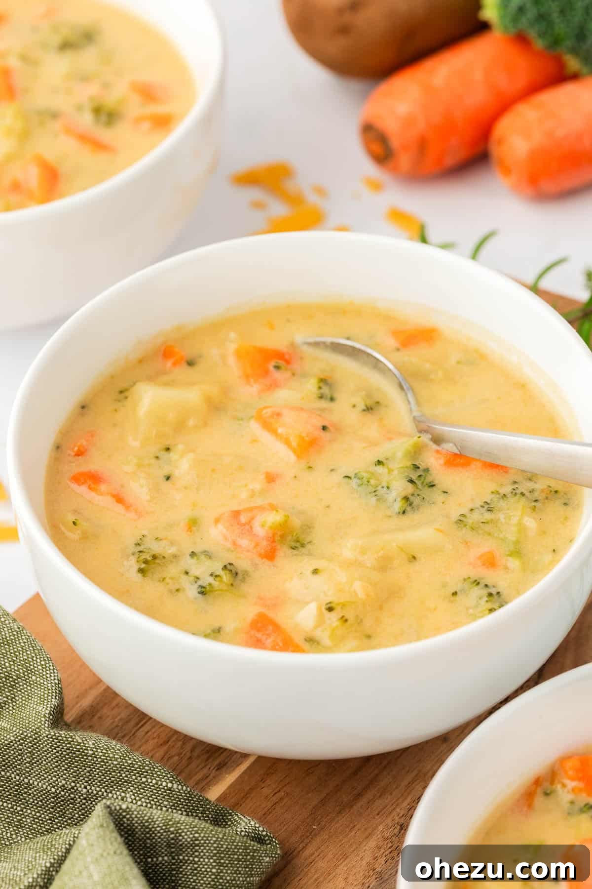 An appetizing overhead shot of a bowl of creamy vegetable soup, perfectly presented and ready to be enjoyed, promising warmth and ultimate satisfaction.