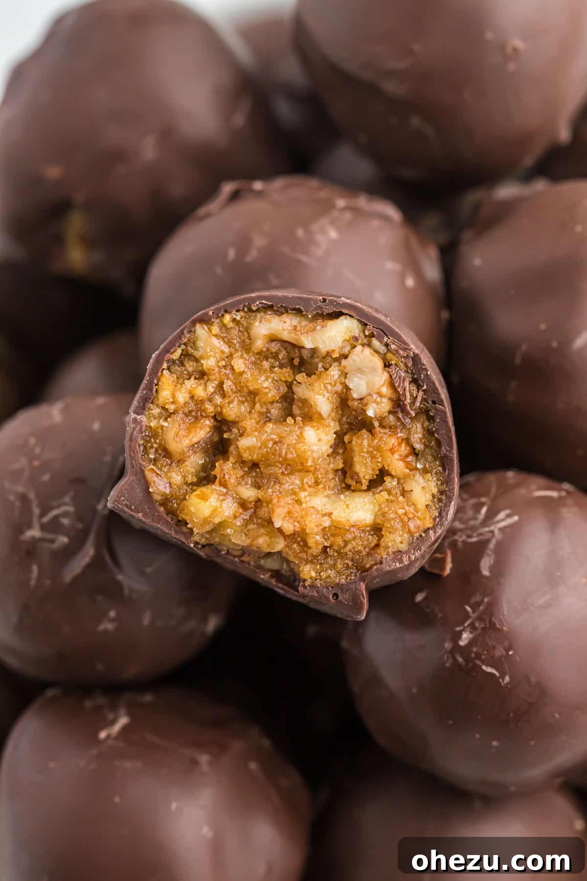 Pecan Pie Truffles 12 A final close-up image of a no bake pecan pie ball with a bite removed, emphasizing its perfect texture and appealing presentation.