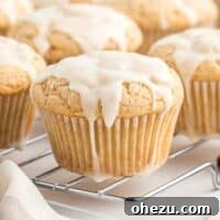 Glazed eggnog muffins on a wire cooling rack