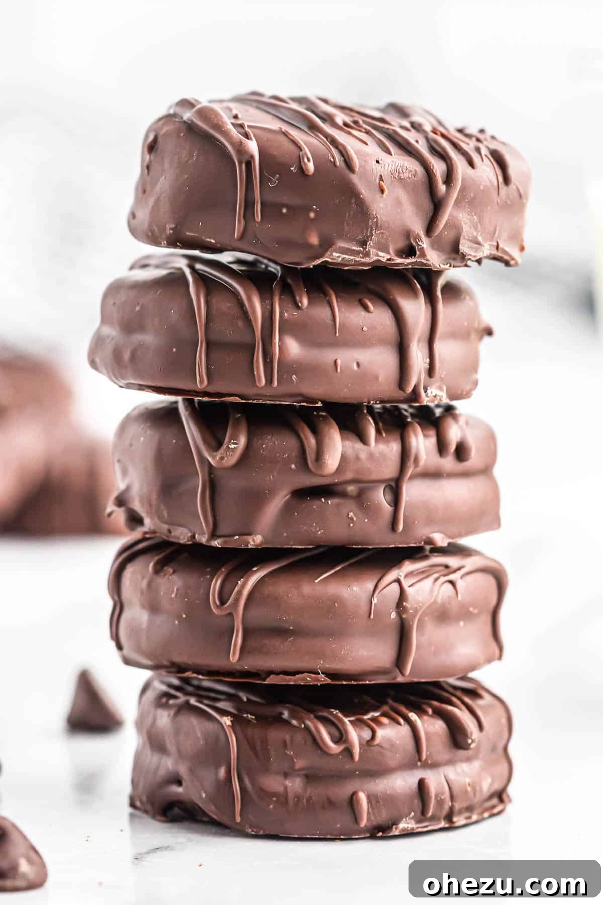 Decadent Oreo Delights 2 Stacked chocolate covered Oreos, beautifully decorated, ready to be enjoyed.