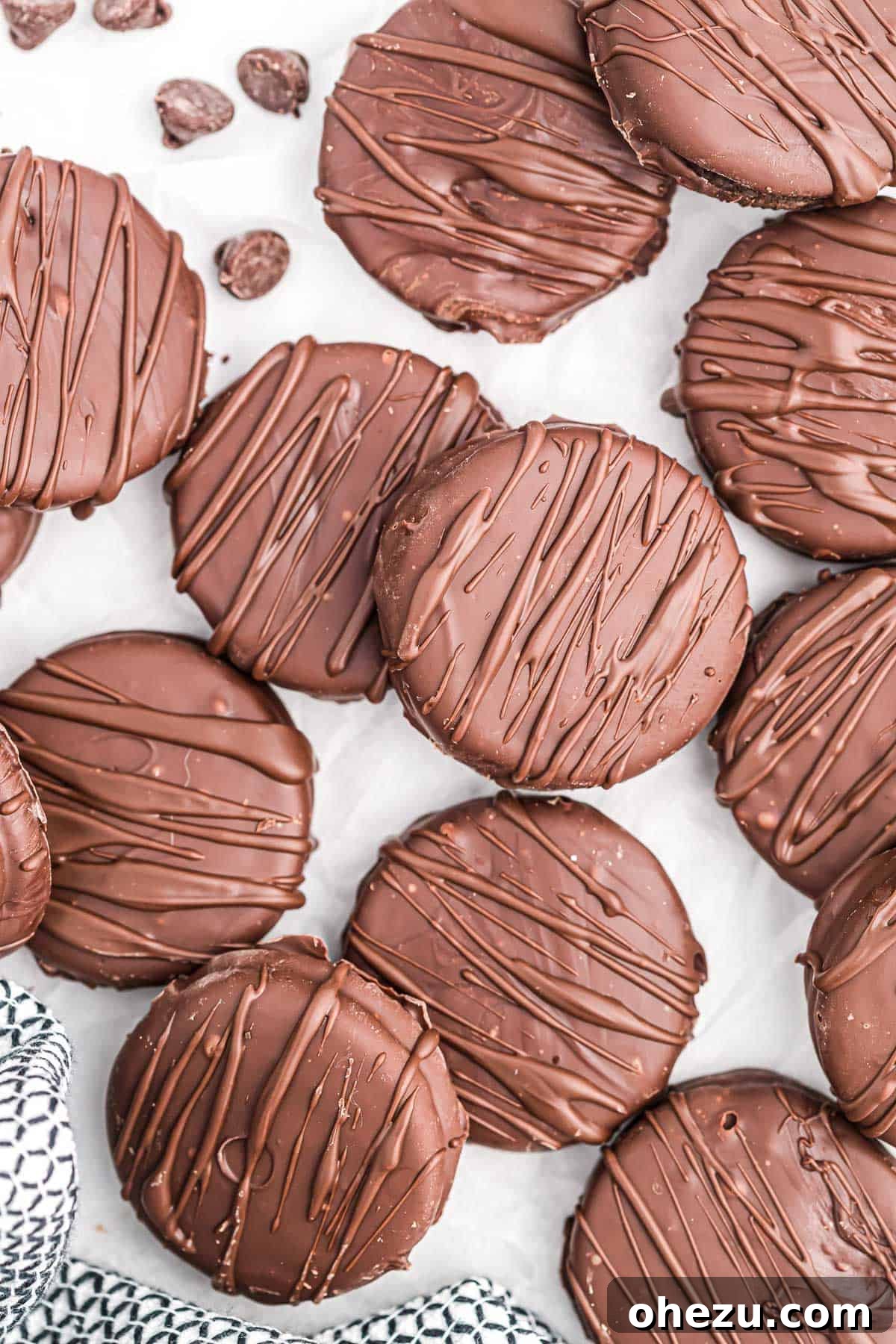 Decadent Oreo Delights 3 Freshly made chocolate covered Oreos resting on wax paper, cooling down.