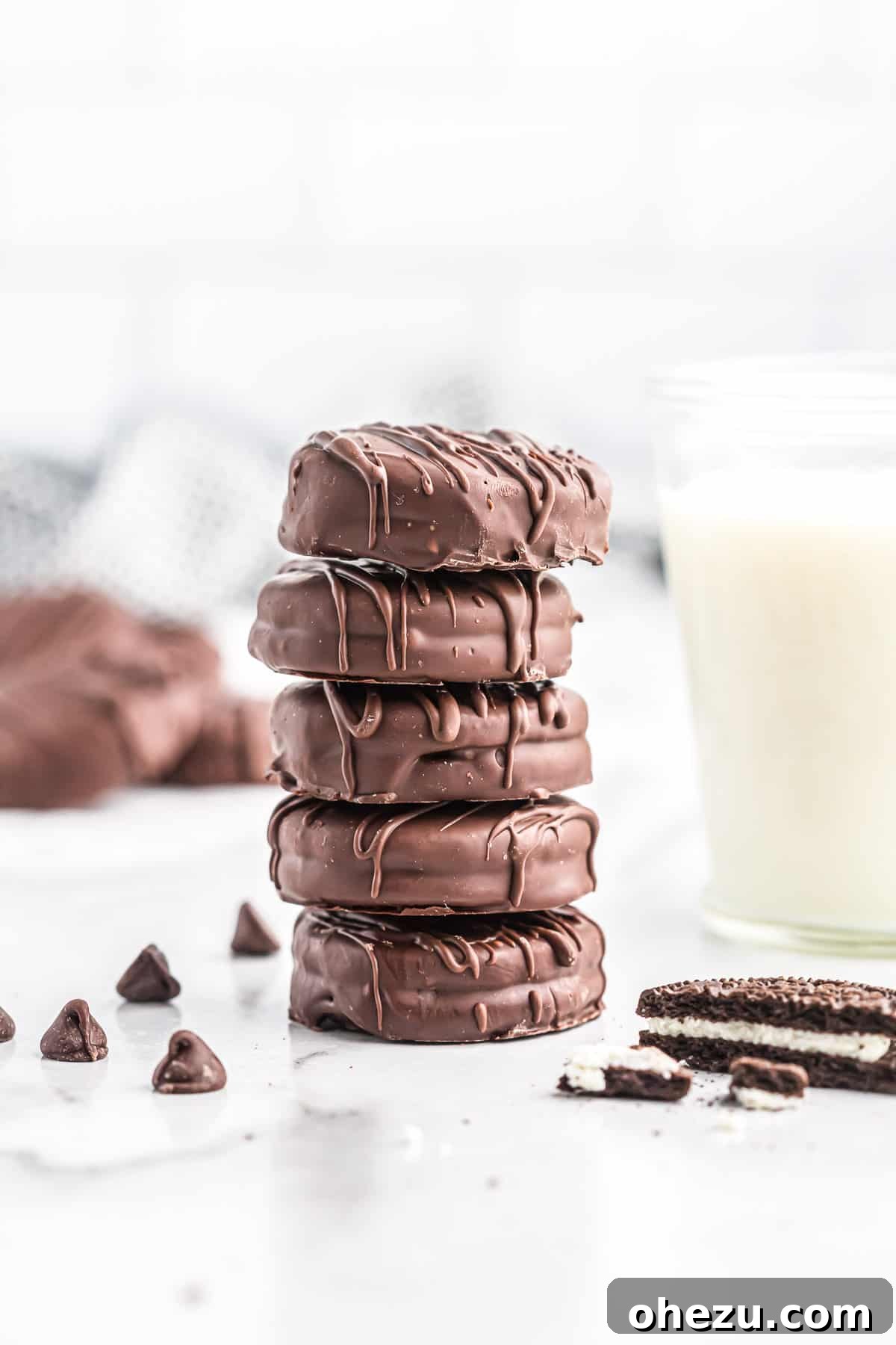 Decadent Oreo Delights 9 Several chocolate covered Oreos stacked on a plate, showcasing their perfect coating and appealing appearance.