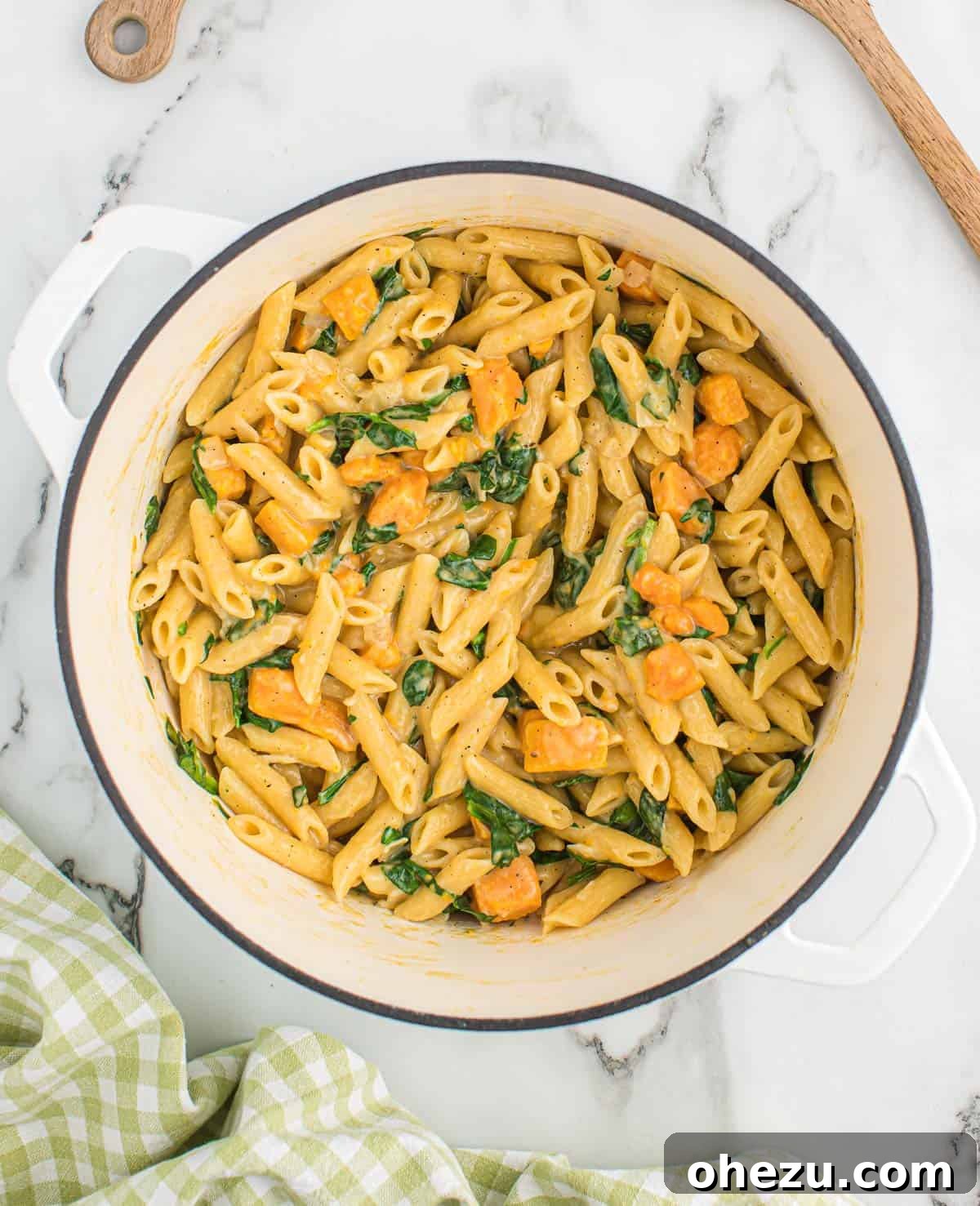 Velvet Sweet Potato Pasta 10 The finished sweet potato pasta, richly creamy and vibrant, served in a white Dutch oven.