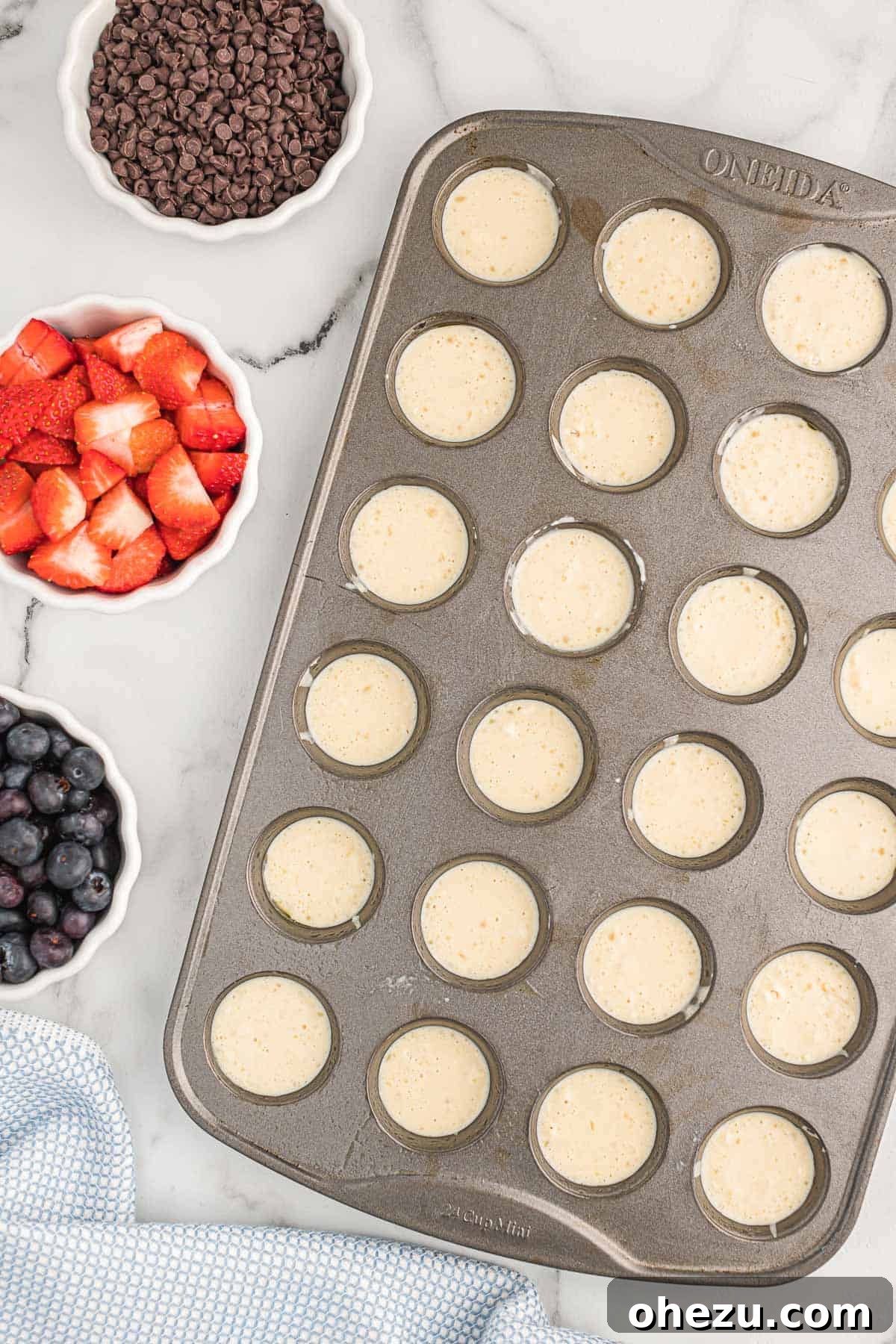Baked Pancake Bites 8 A mini muffin tin filled with pancake batter, ready for toppings and baking