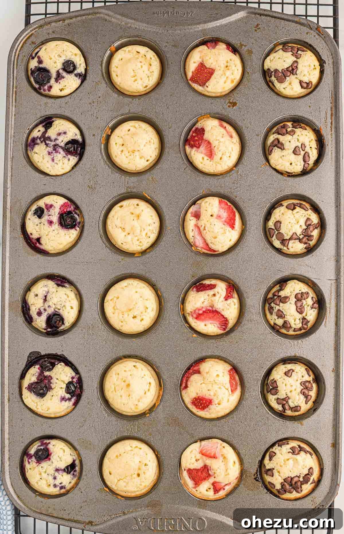 Baked Pancake Bites 10 Another view of the mini muffin tin filled with pancake batter and various toppings before going into the oven