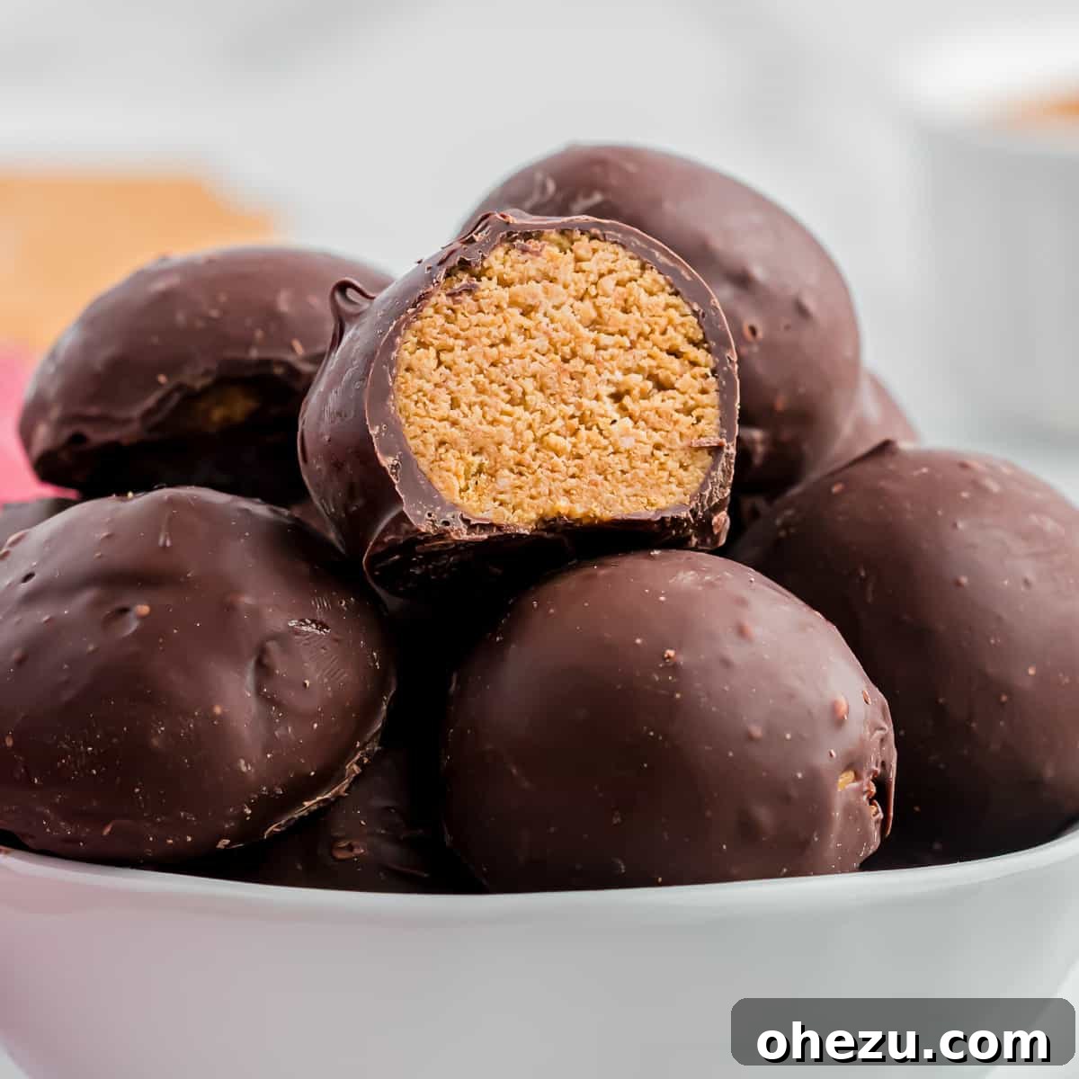 Delicious no-bake peanut butter balls with graham crackers, coated in chocolate and arranged on a festive platter