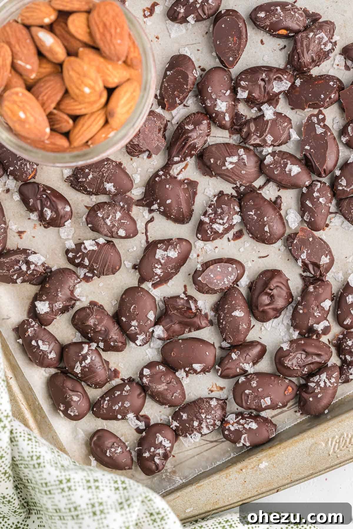 Close-up of perfectly coated dark chocolate covered almonds, showcasing their rich texture and alluring finish.