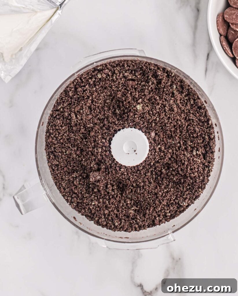 Emerald Oreo Delights 5 Finely crushed Mint Oreos in a food processor, ready to be mixed with cream cheese.