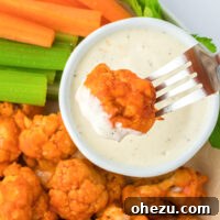 Crispy Air Fryer Buffalo Cauliflower in a bowl with ranch for dipping, representing the final dish.