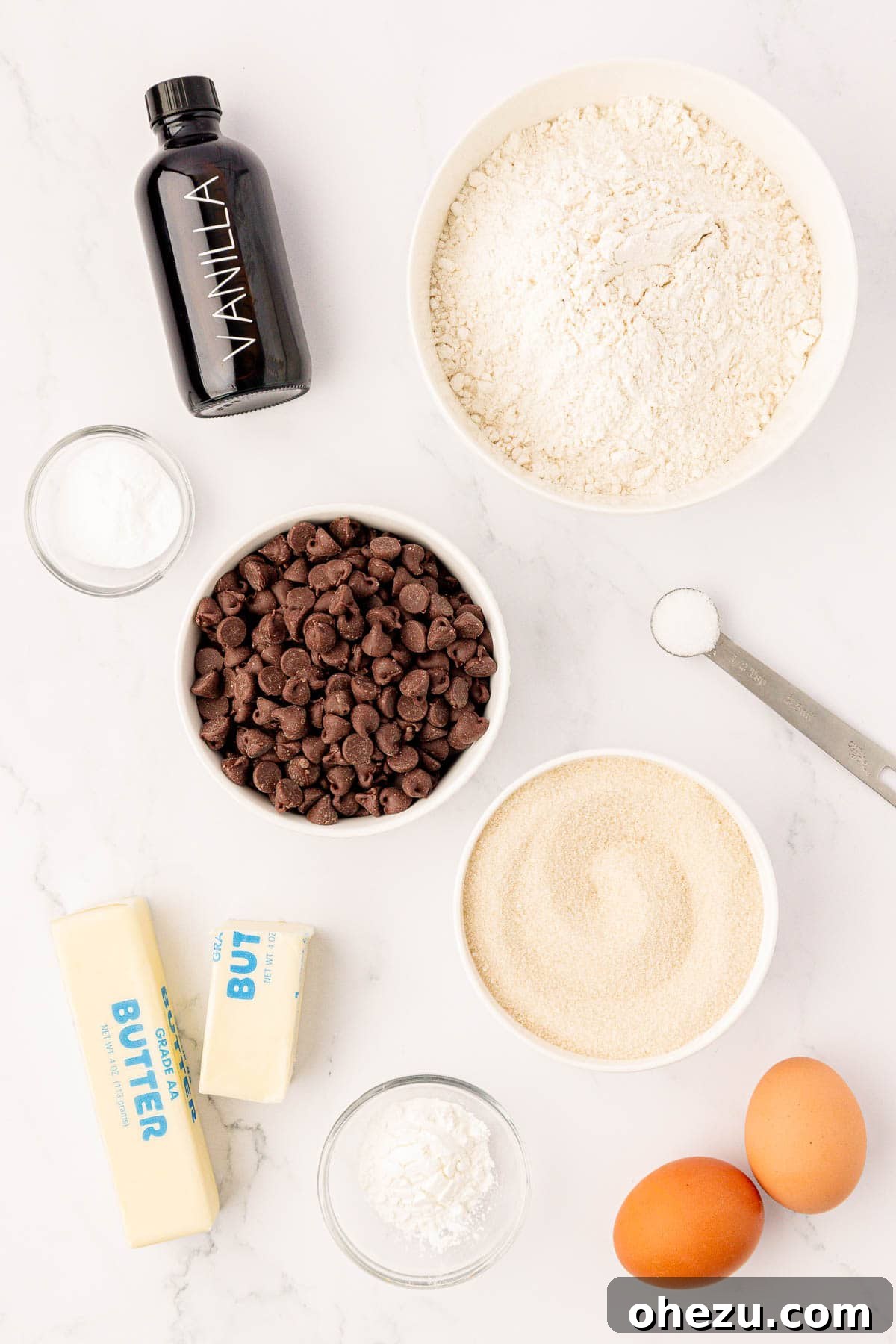 Perfect Chocolate Chip Cookies With No Brown Sugar 4 A beautifully arranged collection of fresh ingredients, including flour, butter, sugar, eggs, and chocolate chips, ready for baking cookies
