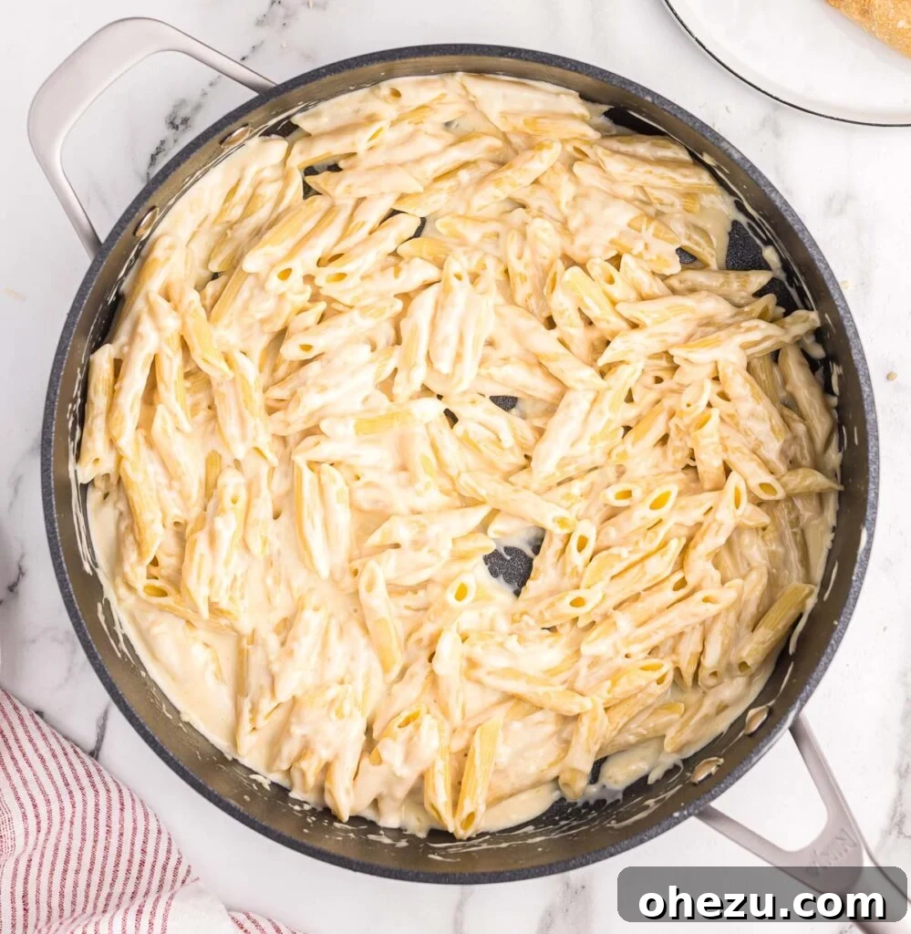 creamy penne pasta in a skillet