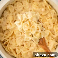 wooden spoon with bow tie pasta