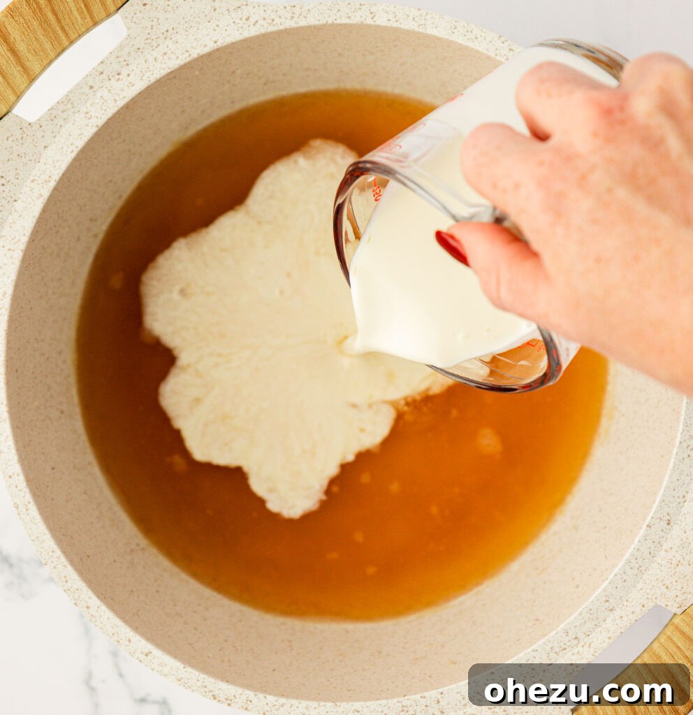 Farfalle Flair 9 Adding heavy cream to the simmering broth and roux mixture.