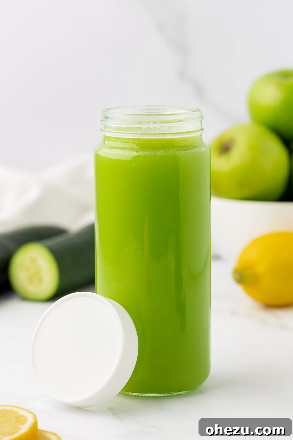 A mason jar filled with fresh cucumber juice, sealed for storage, emphasizing practical healthy habits.