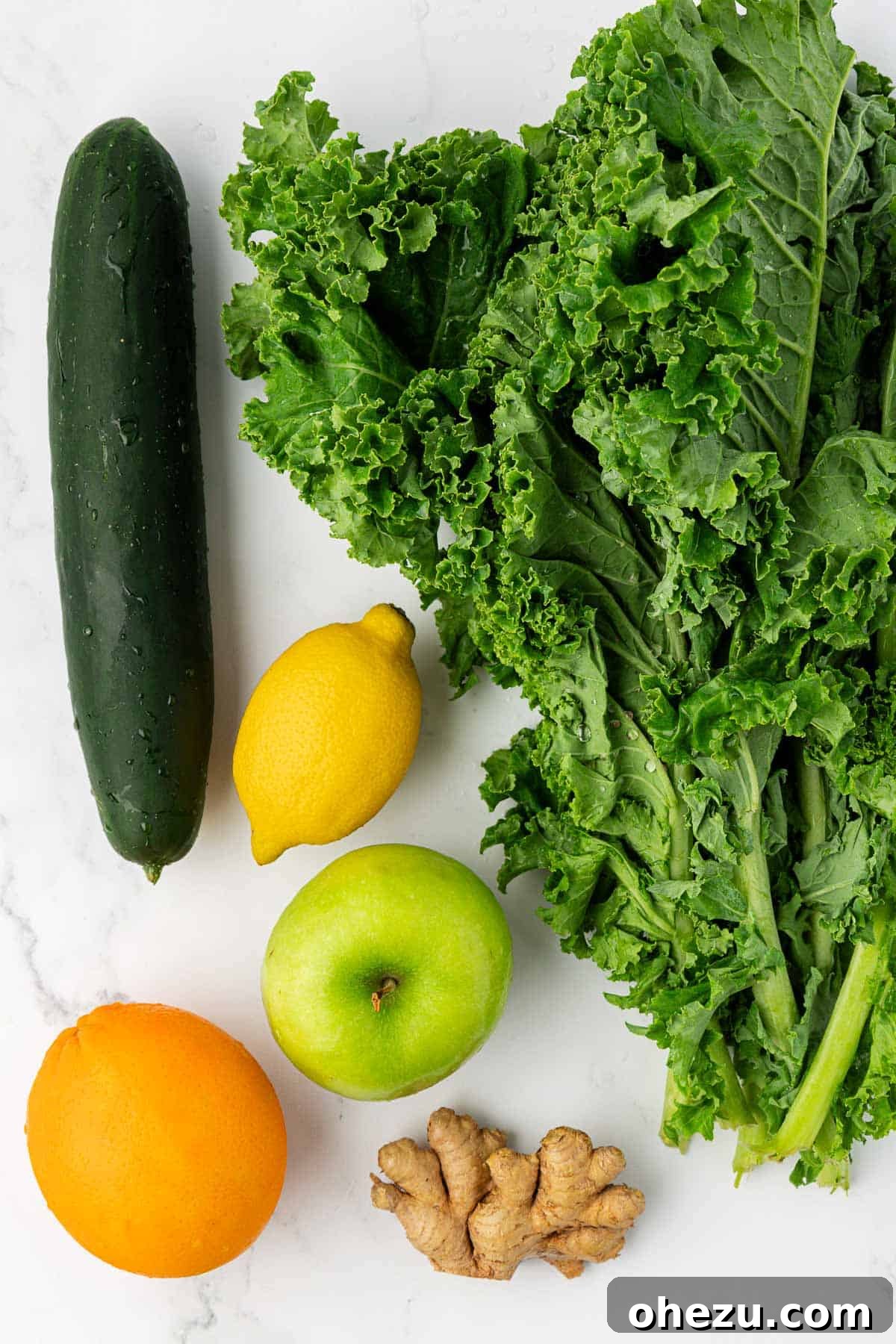 kale, cucumber, lemon, green apple, orange, and ginger