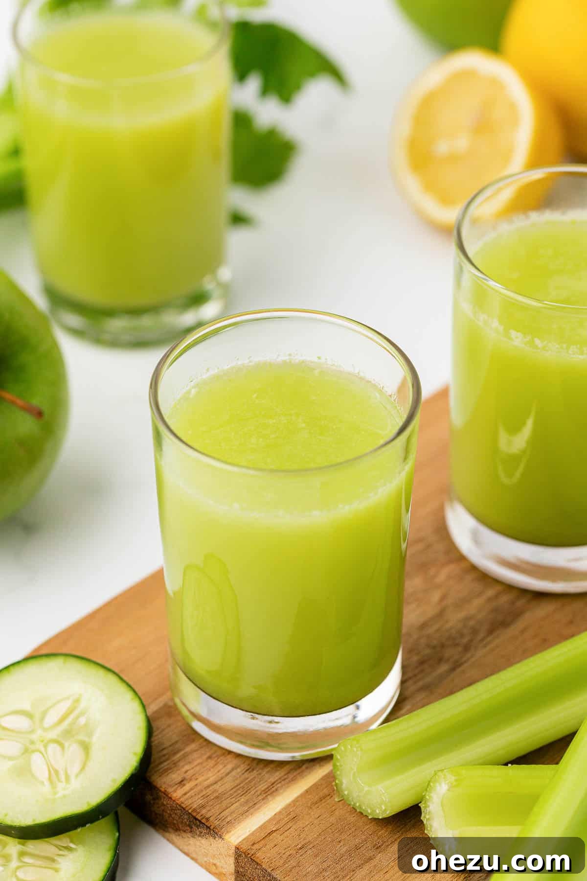 celery juice in a glass with a vibrant green color