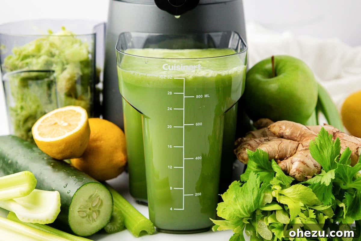 celery juice next to a juicer, illustrating the juicing process