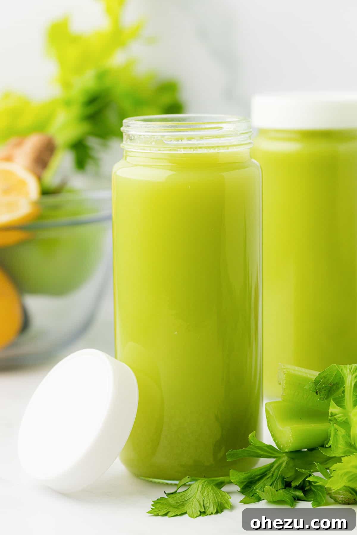 celery juice in a glass with a lid, stored for freshness