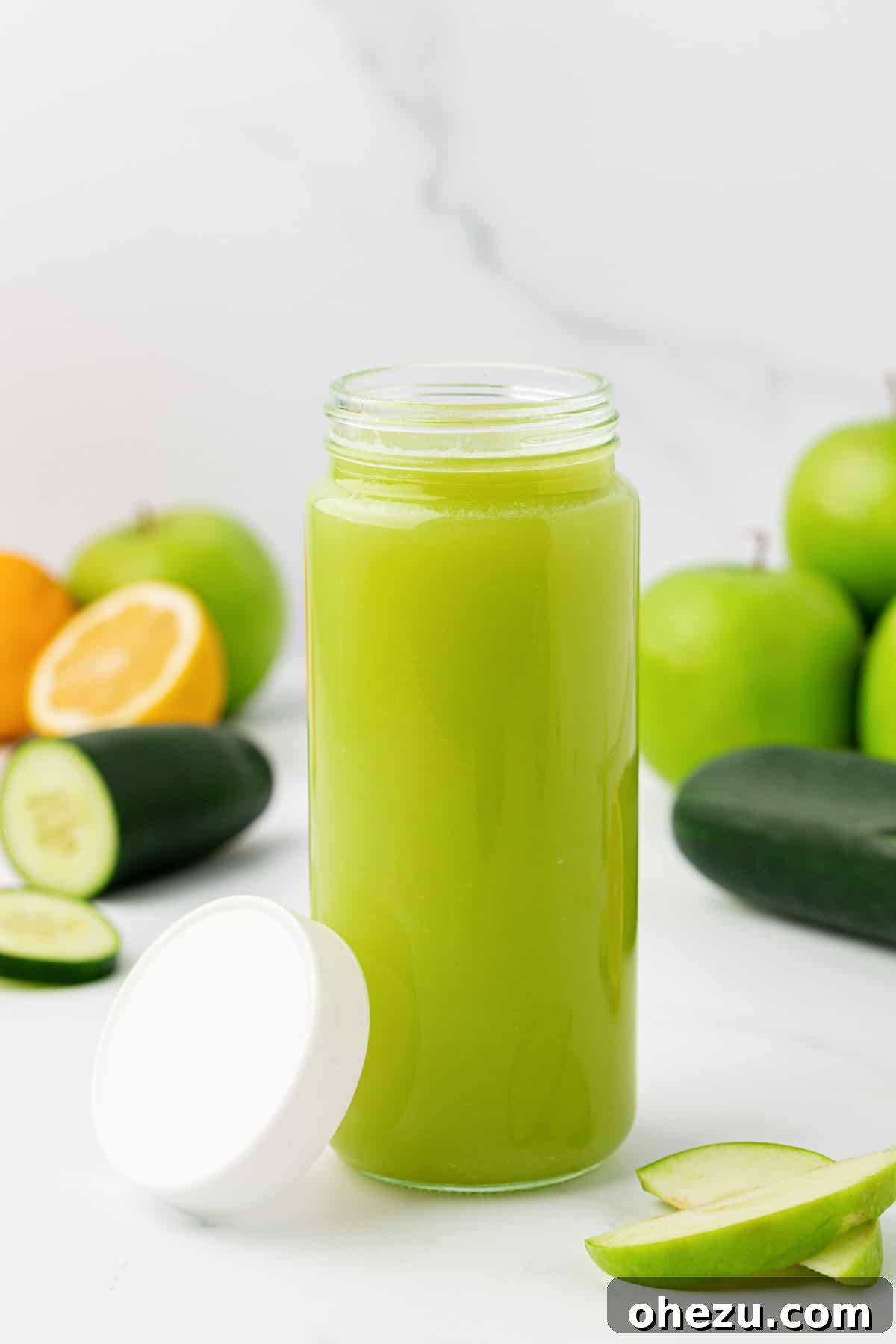 Green apple juice securely sealed in a glass storage jar with a lid