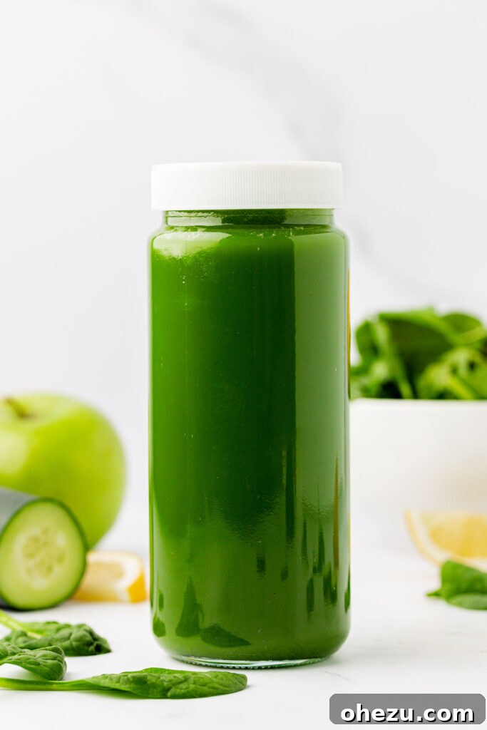 Green Vitality Boost 10 Close-up of a glass jar filled to the brim with green spinach juice, emphasizing proper storage technique.