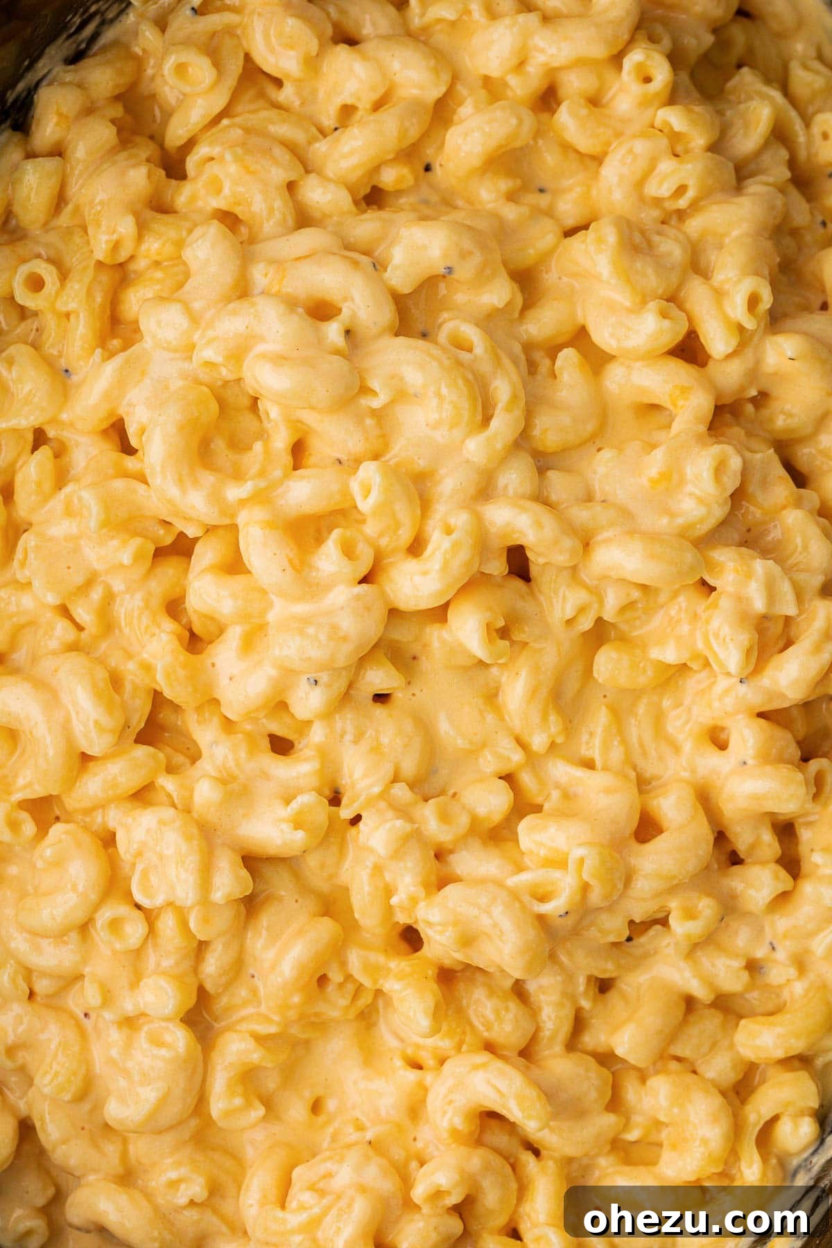Creamy Slow Cooker Mac and Cheese 3 Close-up of exceptionally creamy mac and cheese, showcasing its smooth and inviting texture.