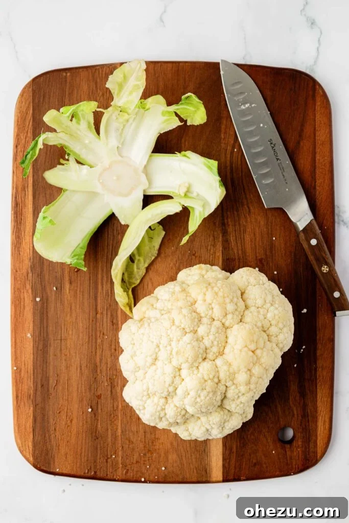 whole cauliflower on a cutting board