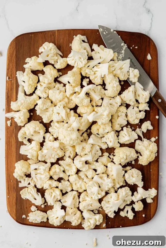evenly cut cauliflower florets on a cutting board