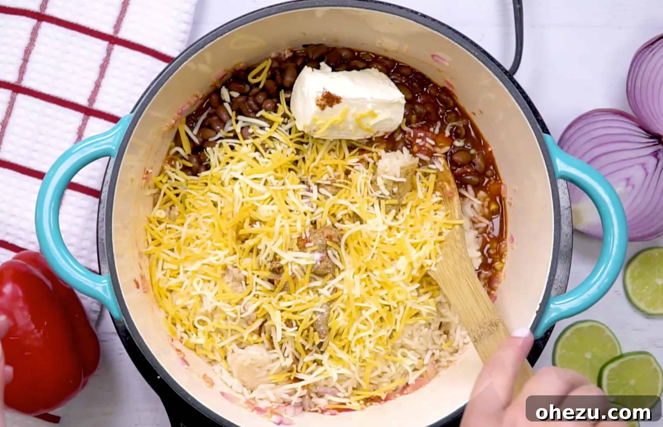 Fiesta Vegetarian Bake 12 The fully mixed Mexican cheese rice casserole in a large pan, steaming